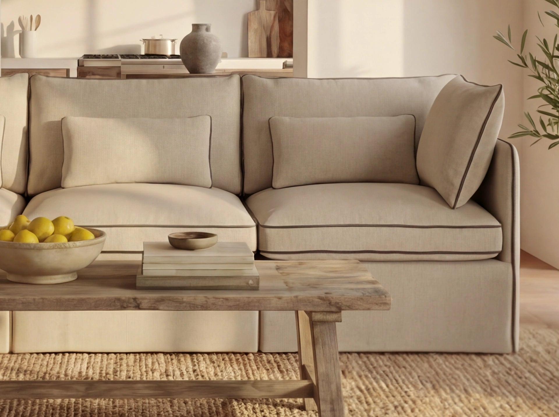Beige sofa in a living room with a wooden coffee table and decorative items.