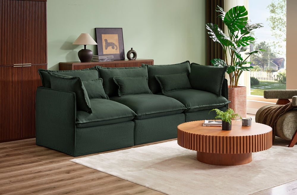 Modern living room with a dark green sofa